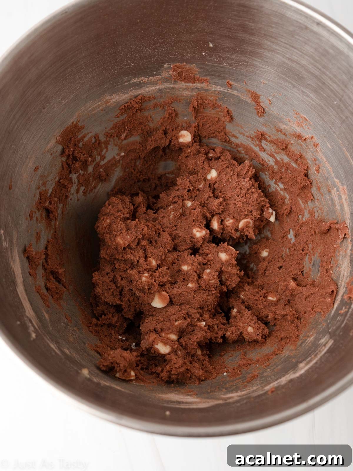 Red velvet chocolate chip cookie dough in a bowl.