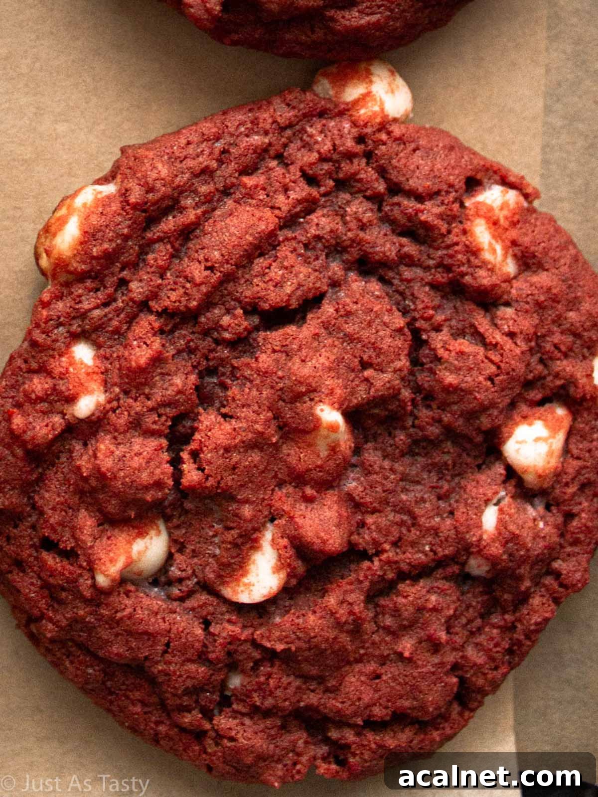 Close-up of a red velvet chocolate chip cookie.