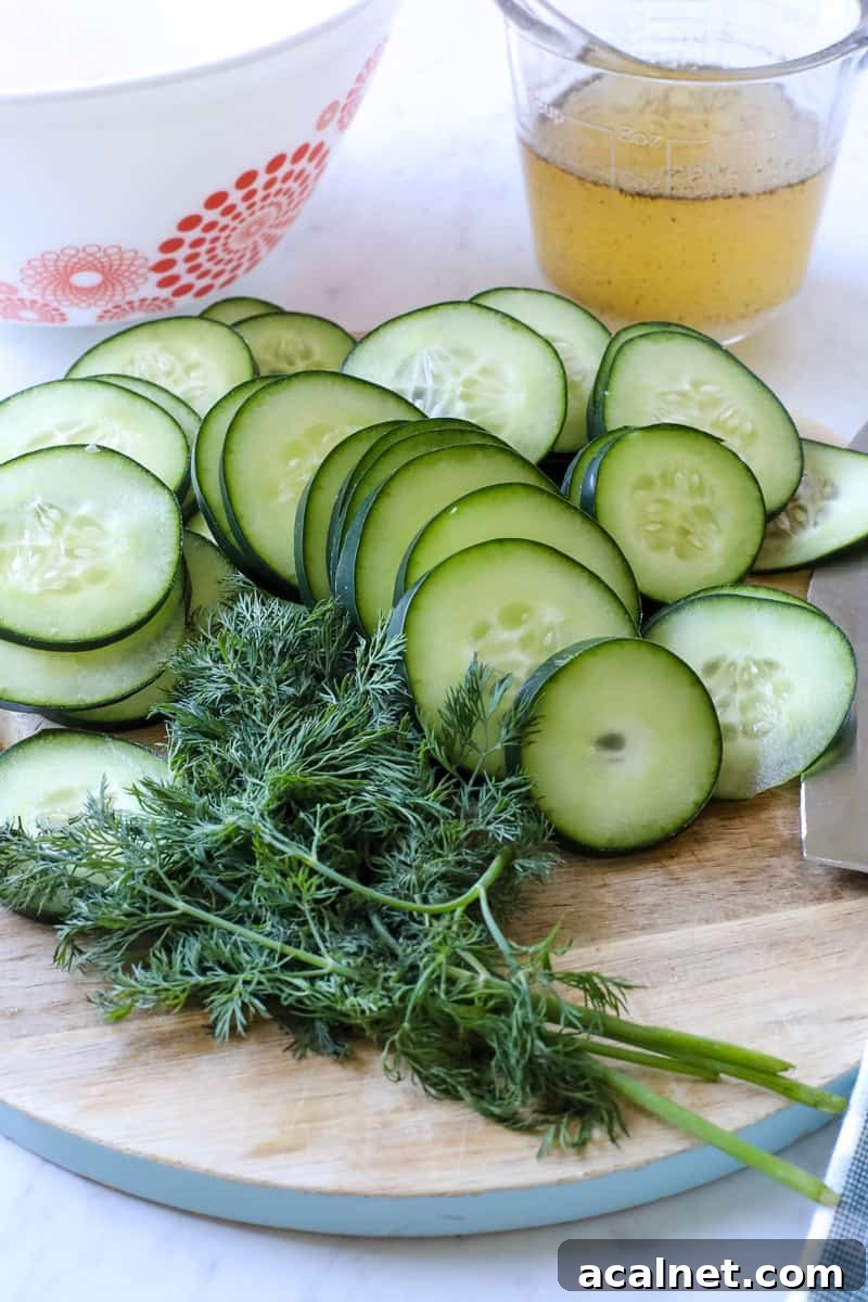 cucumbers, fresh herbs, dressing, on a table