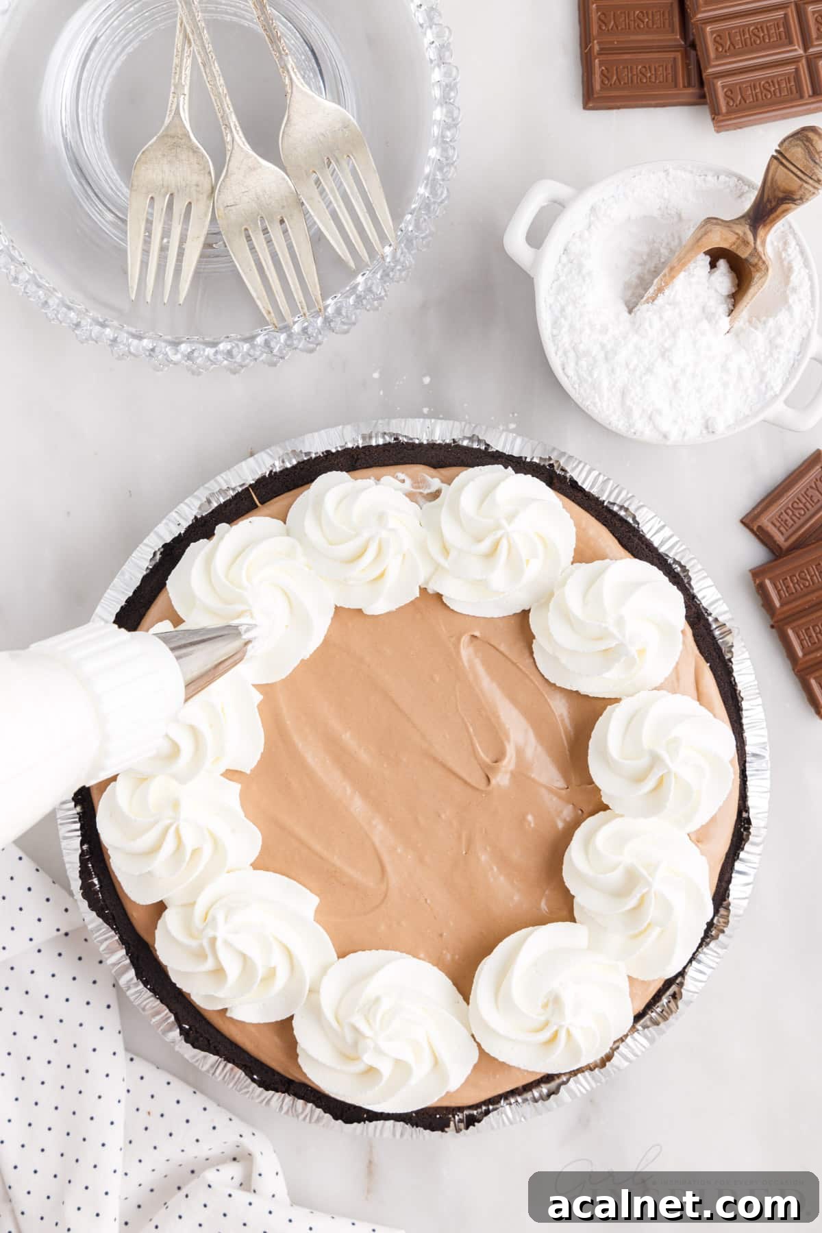 Cool whip piped around edges of pie.