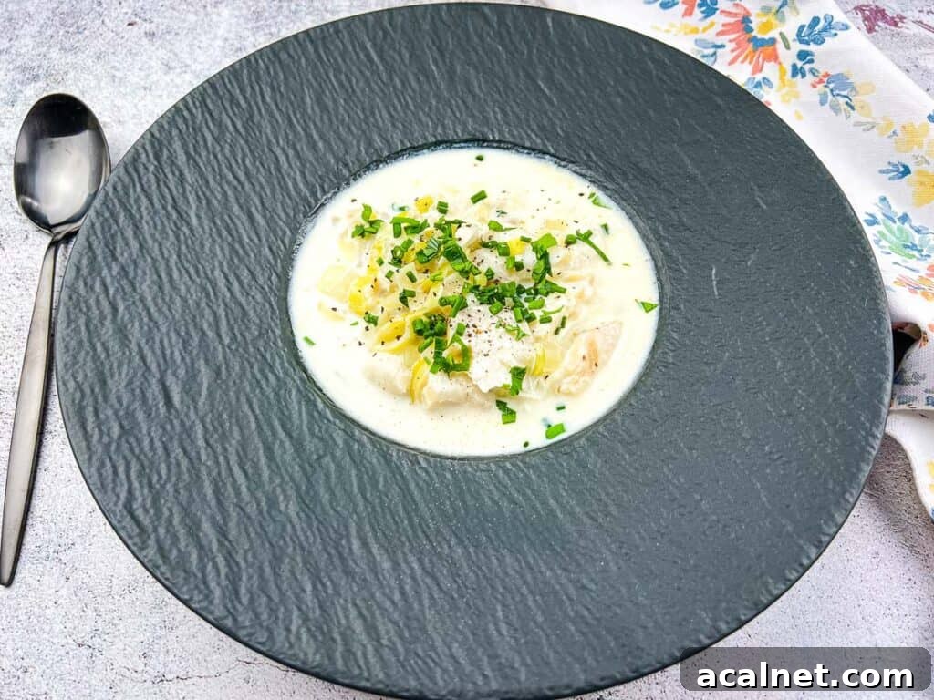 Cullen Skink soup in a black bowl.