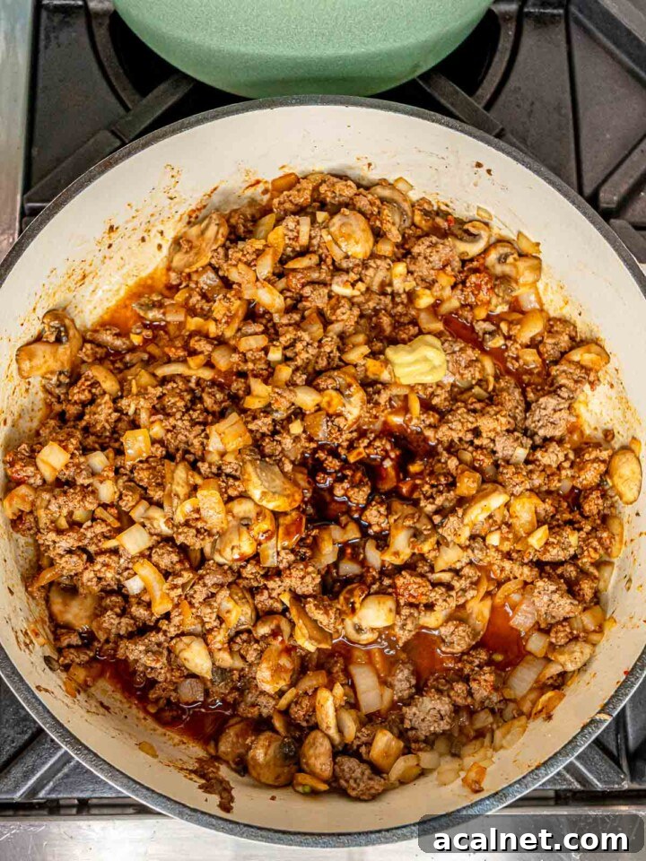 Worcestershire sauce, Dijon mustard, and white wine stirred into a skillet.
