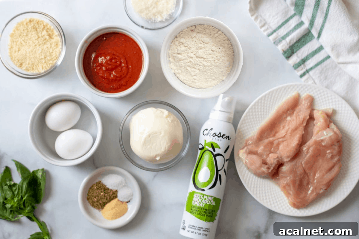 Air Fryer Chicken Parmesan Recipe Ingredients for Air Fryer Chicken Parmesan on counter.
