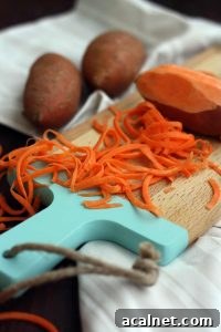 Healthy Sweet Potato Noodle Salad with Chickpeas and Rocket - Preparing Carrot Closeup