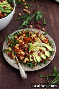 Healthy Sweet Potato Noodle Salad with Chickpeas and Rocket - Sharp and Clean Shot of the Dish on the Brown Table