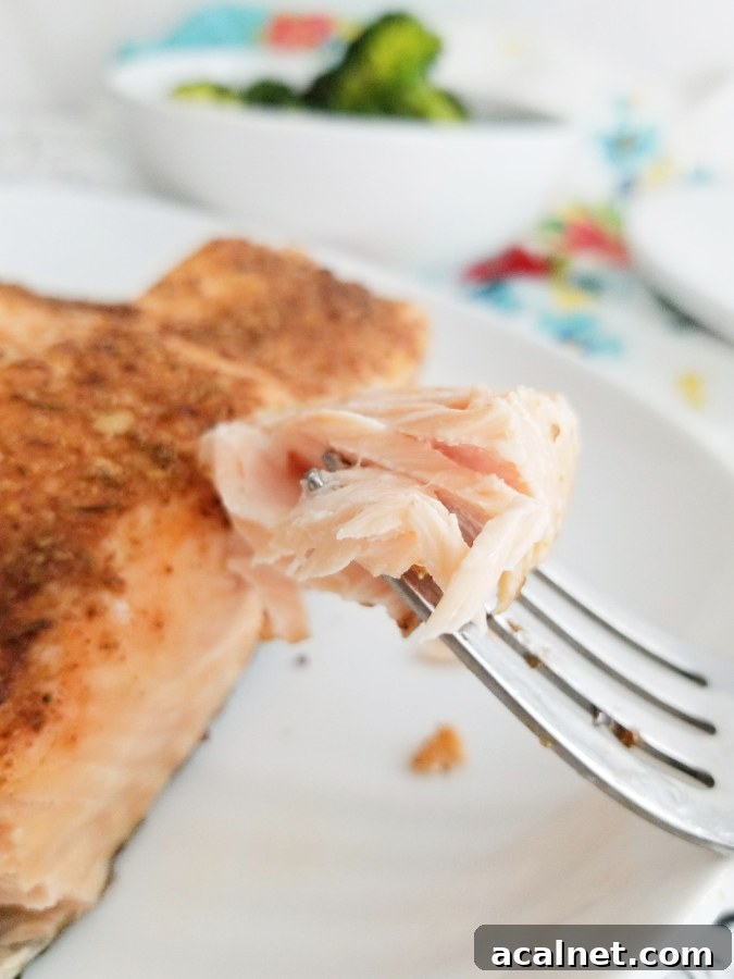 Air Fryer Blackened Salmon piece on fork 