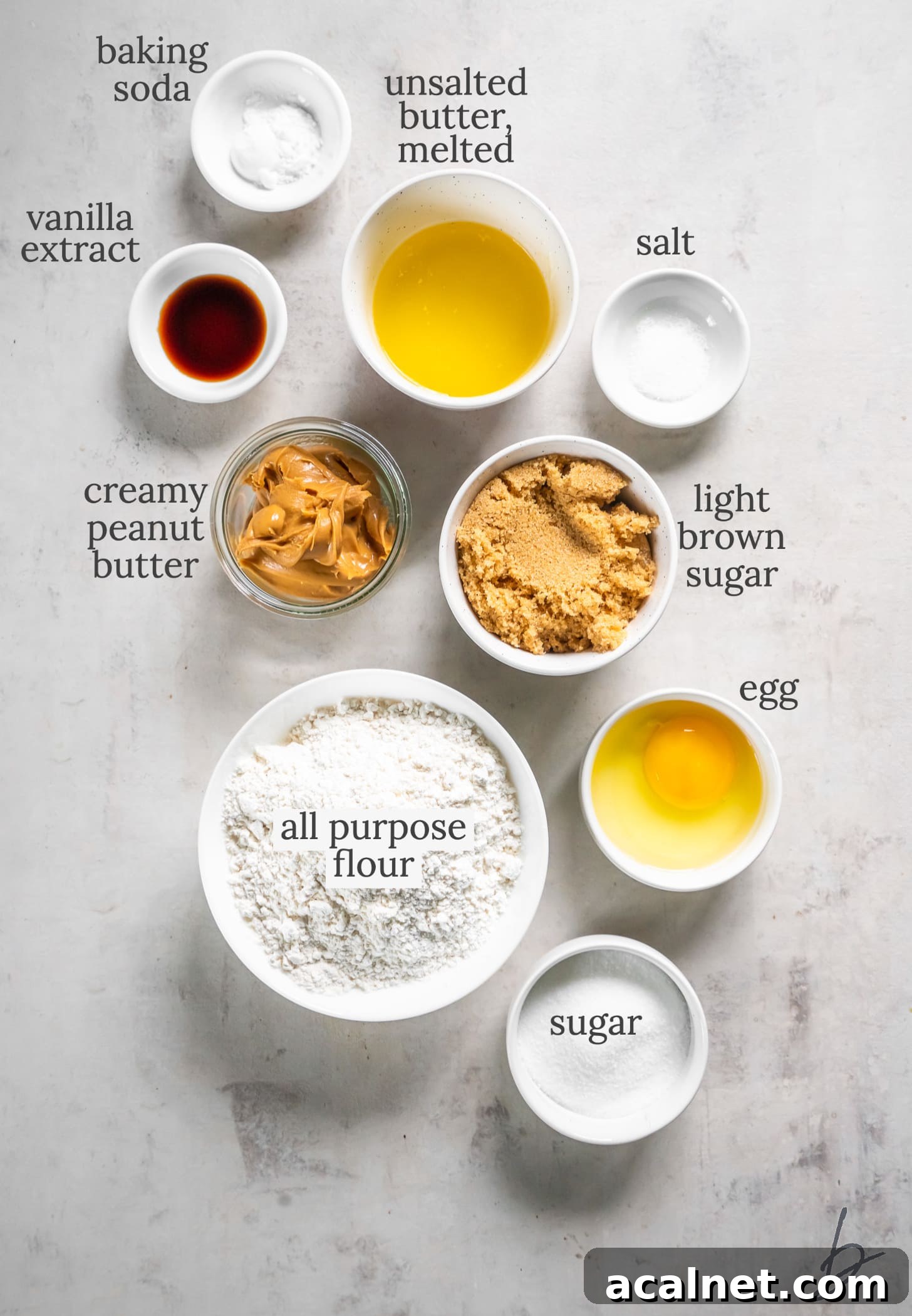 Chewy Peanut Butter Cookie Bar Recipe for Busy Bakers 3 peanut butter cookie bars ingredients in bowls labeled with text.