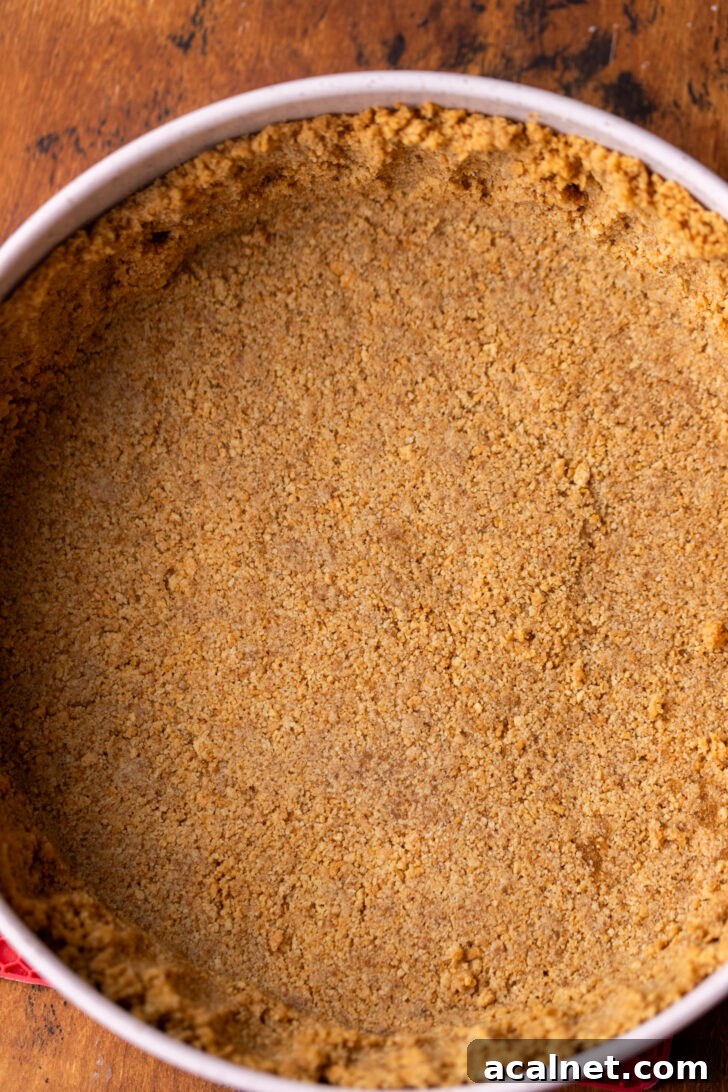 Graham cracker crust in a pan.
