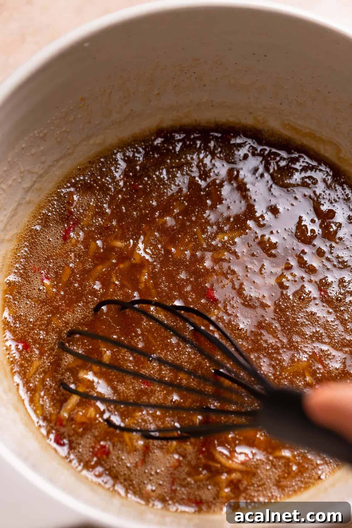 A mixing bowl with the whisked wet ingredients.