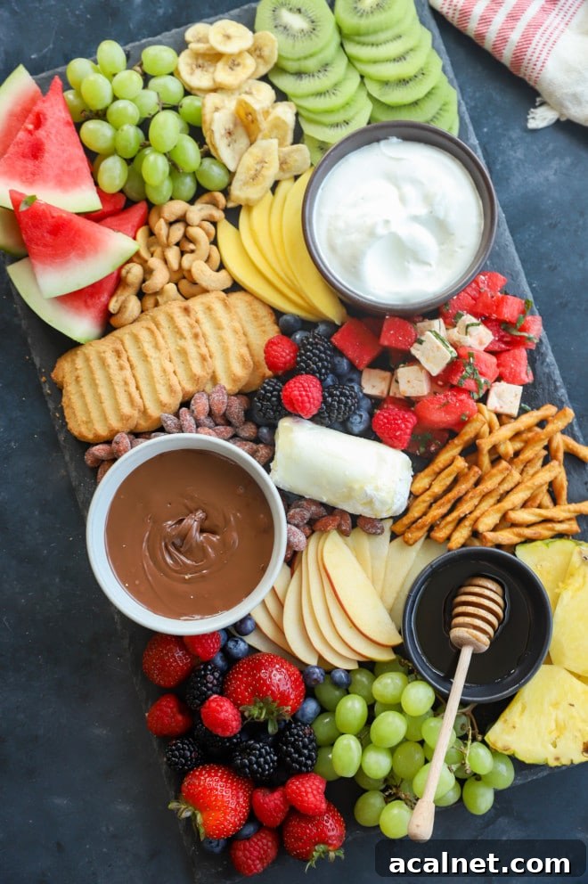 Fresh Fruit Charcuterie Board Ideas for Entertaining 2 Overhead image of platter with a variety of sweets snacks and produce