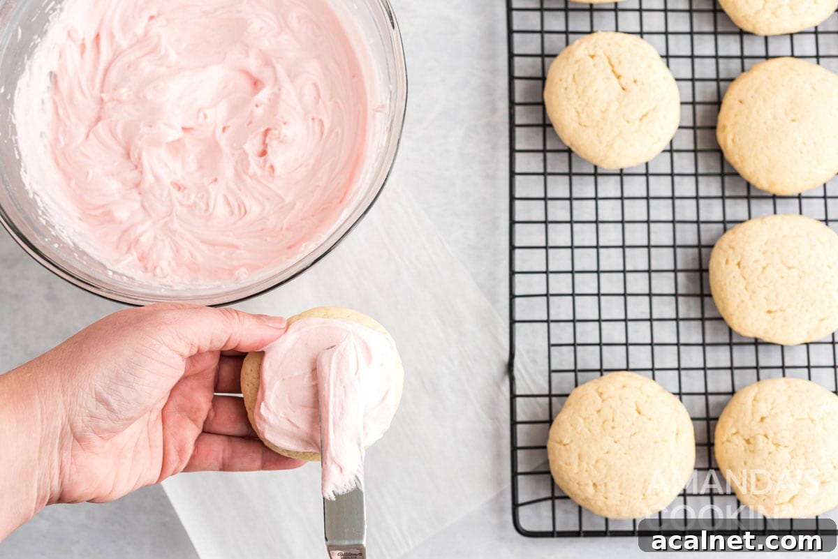 spreading frosting on cookie