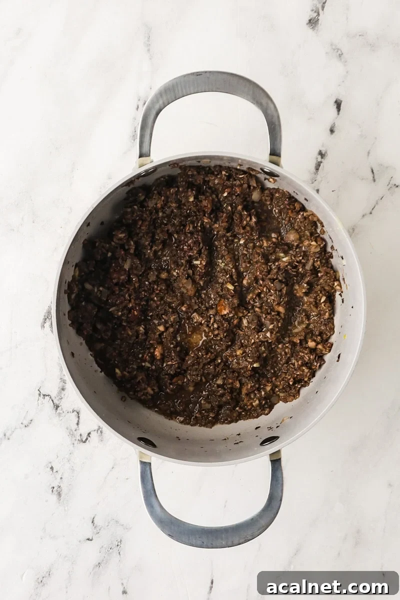 Finely chopped mushrooms cooked down in a saucepan until dry and browned