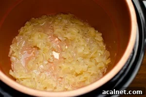 Onions frying in the pressure cooker pot