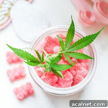 A picture of a container of pink gummies with a cannabis leaf on top.