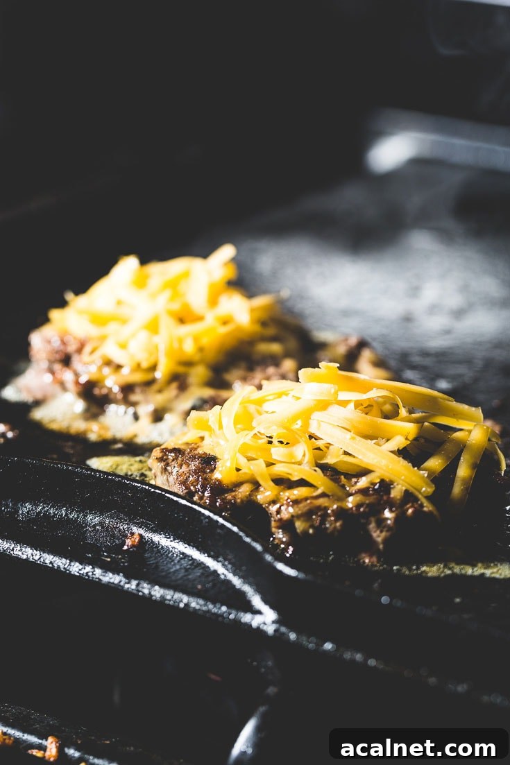 Crispy Flat-Top Cheeseburger Recipe with Caramelized Onions 4 flat top cheeseburger on griddle
