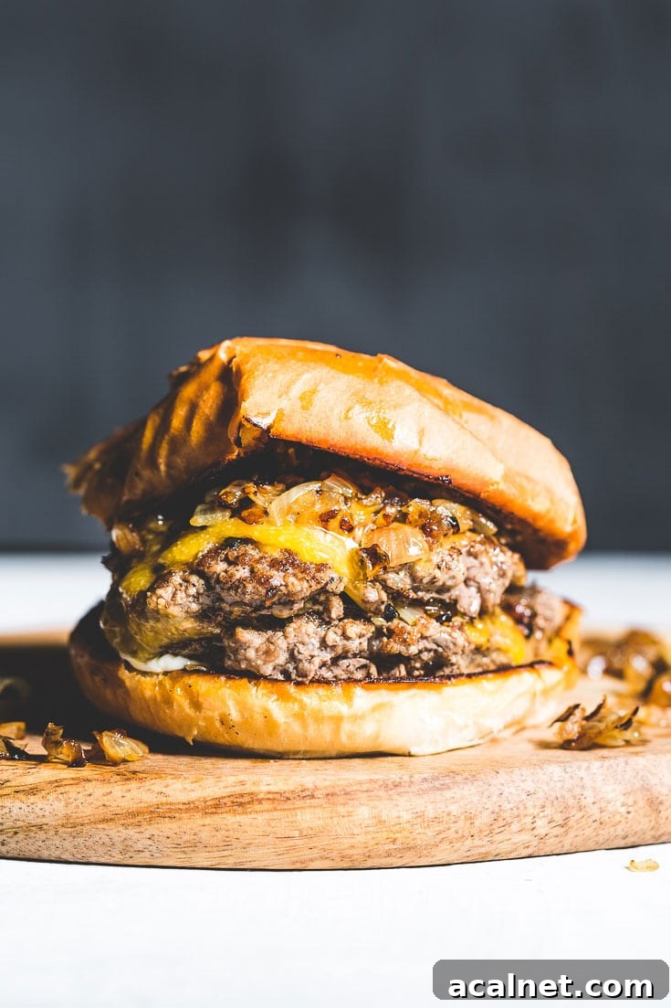 Crispy Flat-Top Cheeseburger Recipe with Caramelized Onions 5 flat top cheeseburger vertical 1