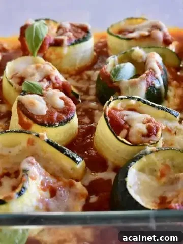 Zucchini Ricotta Roll Ups in a glass pan.