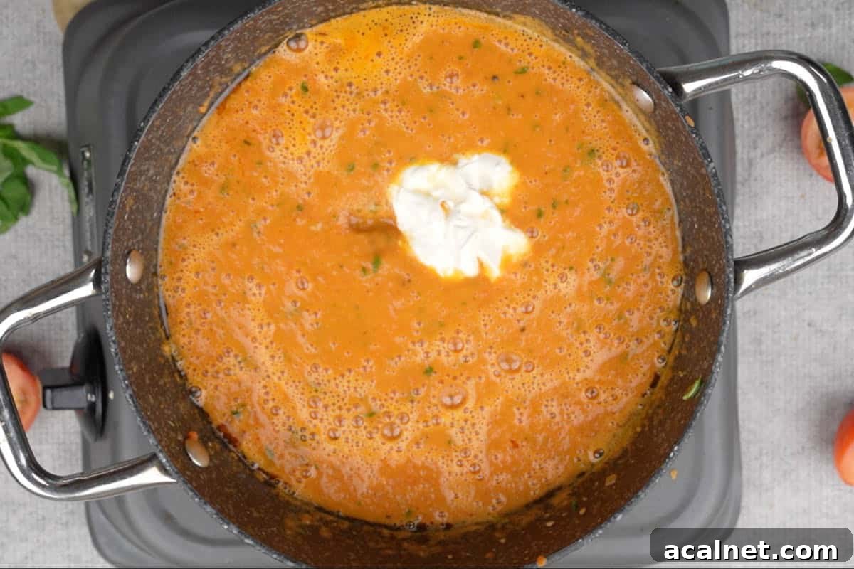 Heavy cream and sugar added to the pan.
