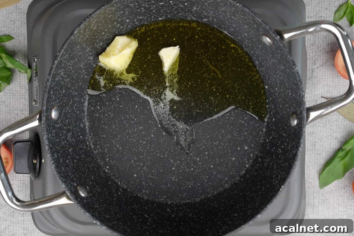 Oil and butter heating in a pan.