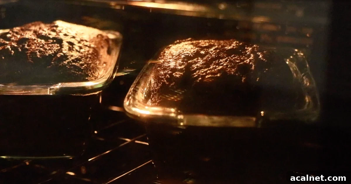 Chocolate banana cakes in dishes rising in the oven.