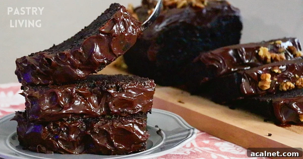 Taking sliced chocolate banana cakes on a plate with a fork.