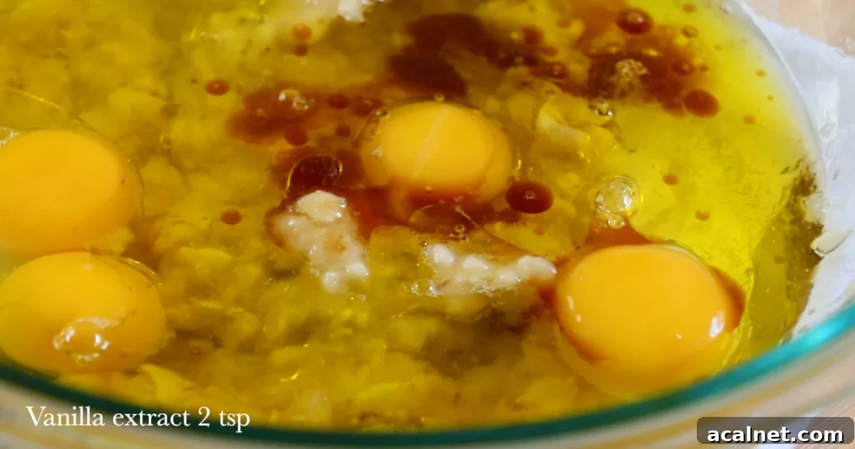 Whole eggs, oil, vanilla and mushed bananas in a large bowl.