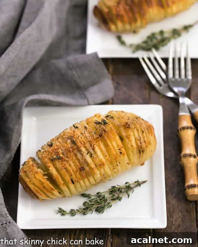 Hasselback Potatoes on square white ceramic plates with bamboo forks