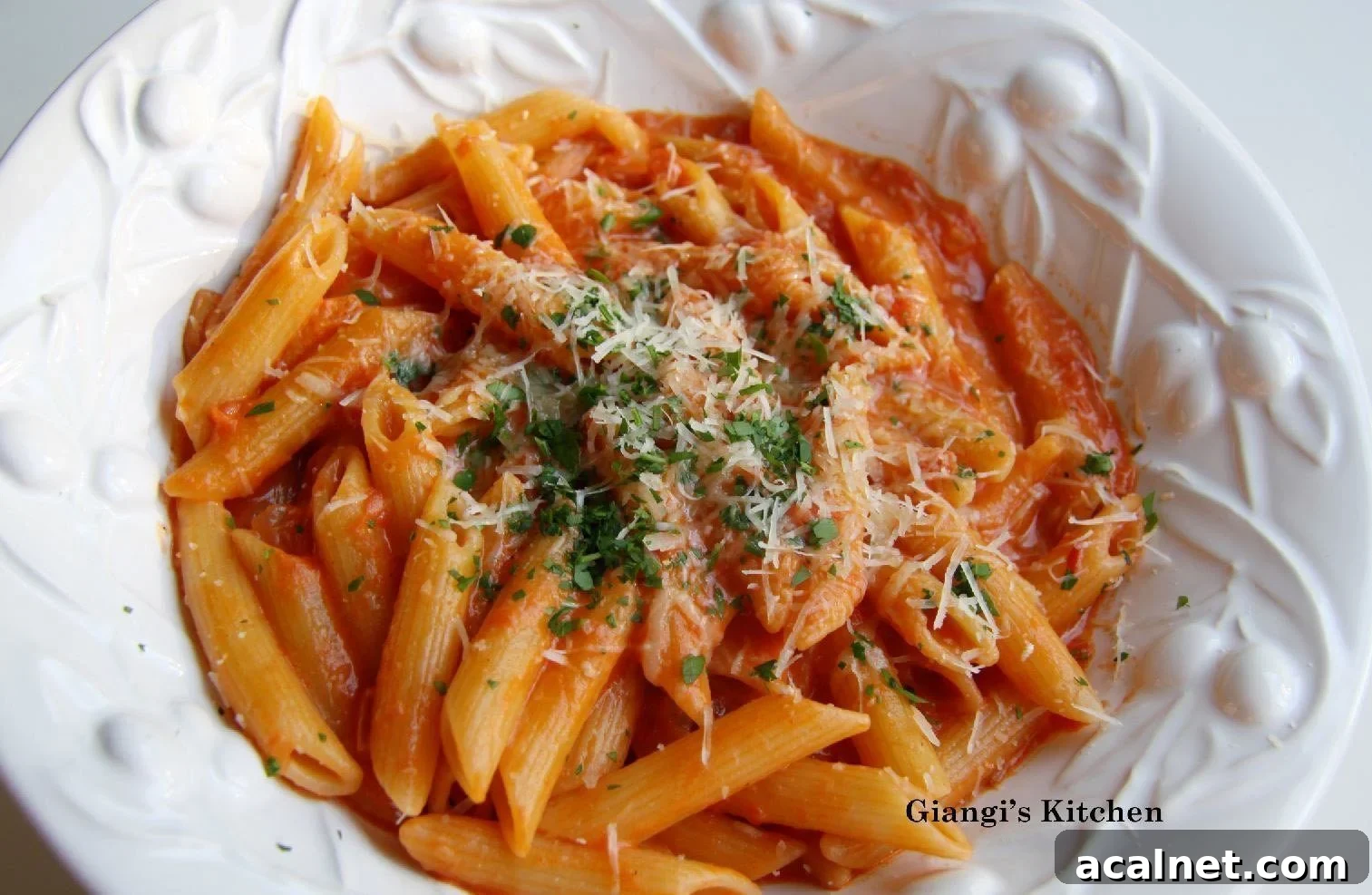 Penne alla Vodka Penne alla vodka in a white serving plate