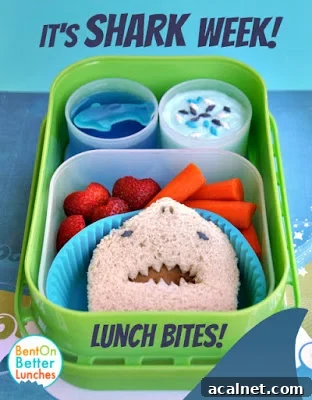 A bunch of sea-themed snacks inside of a bright green lunch box