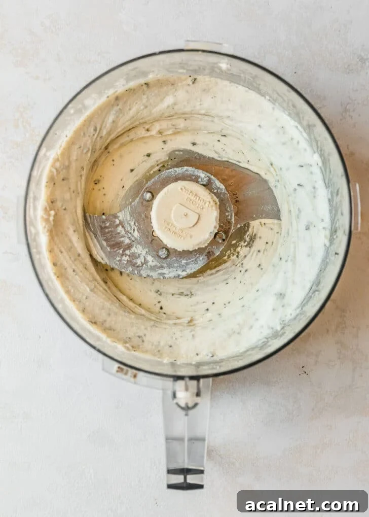Whipped goat cheese in a food processor.