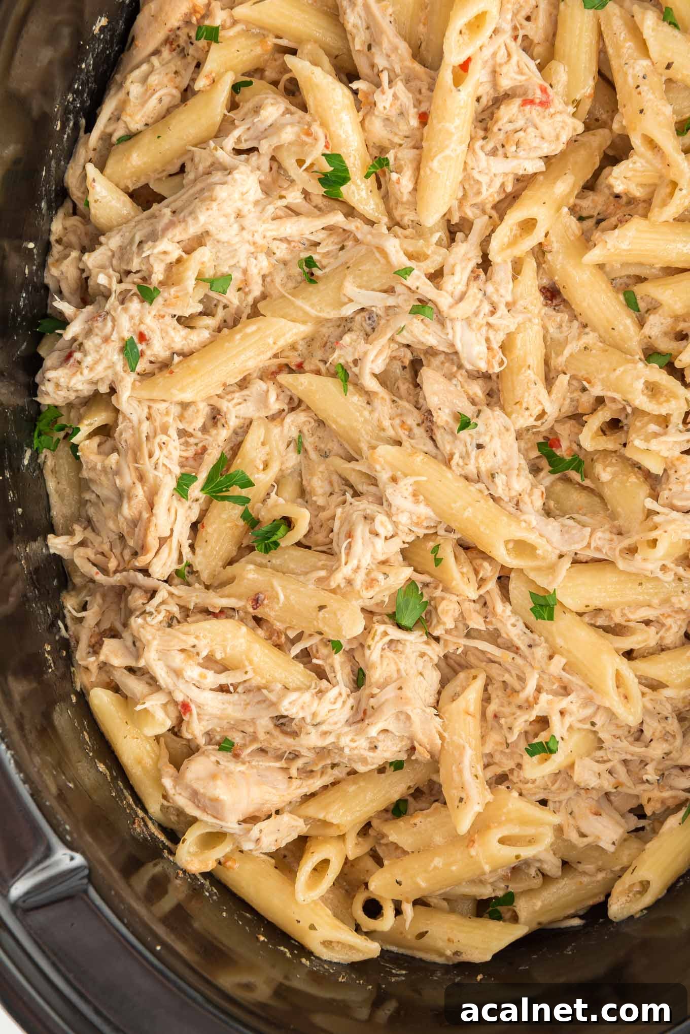 Crockpot garlic parmesan chicken pasta in a crockpot. 