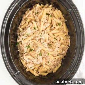 Garlic Parmesan Chicken Pasta made with Buffalo Wild Wings Parmesan Garlic sauce in the crockpot.