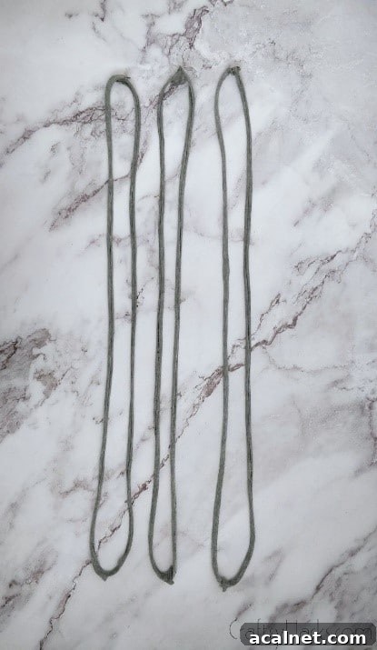 three stretched out loops