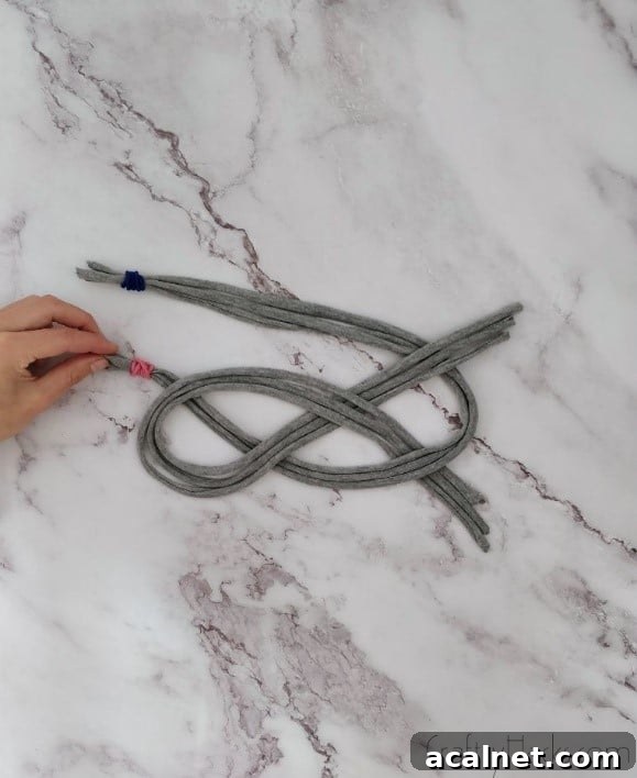 pulling pink elastic under loop