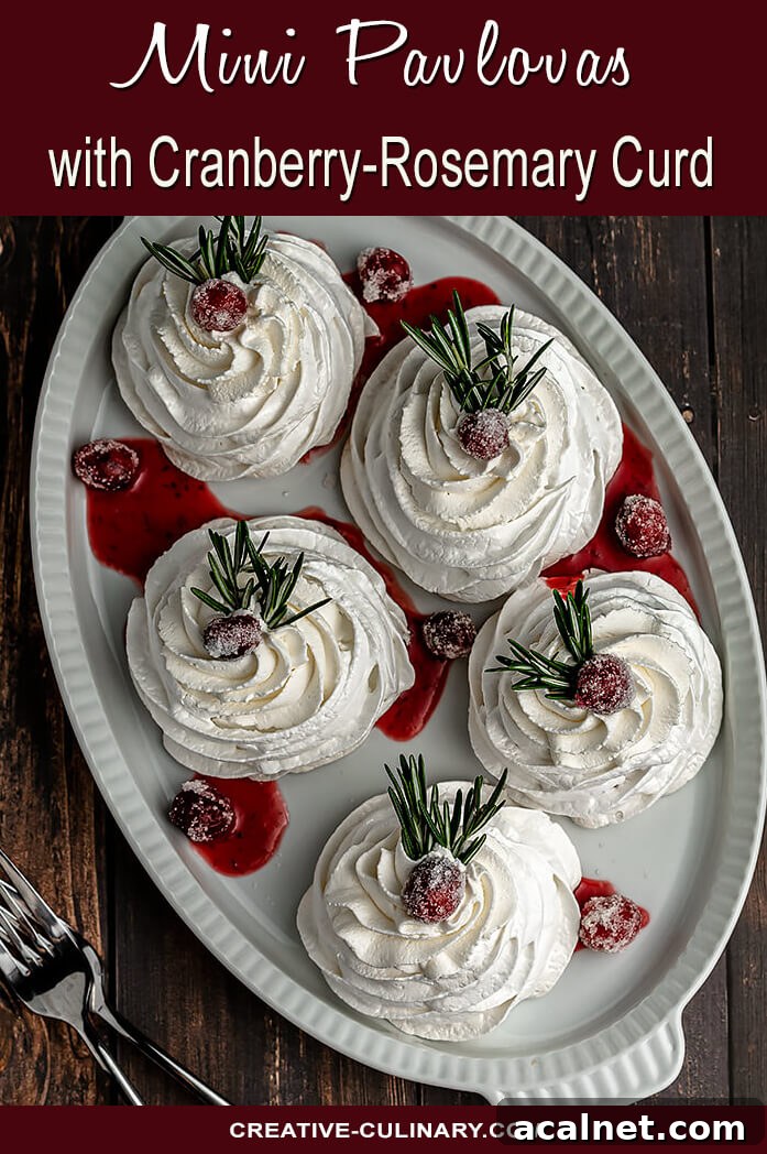 Cranberry Curd Pavlovas: Tart & Creamy Meringue Dessert 9 Mini Pavlovas with Cranberry Curd and Whipped Cream, garnished with Sugared Cranberries and a Sprig of Rosemary