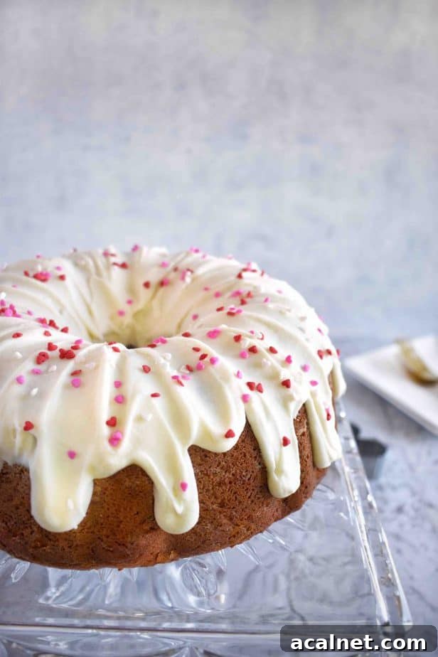 frosted bundt cake on cake plate