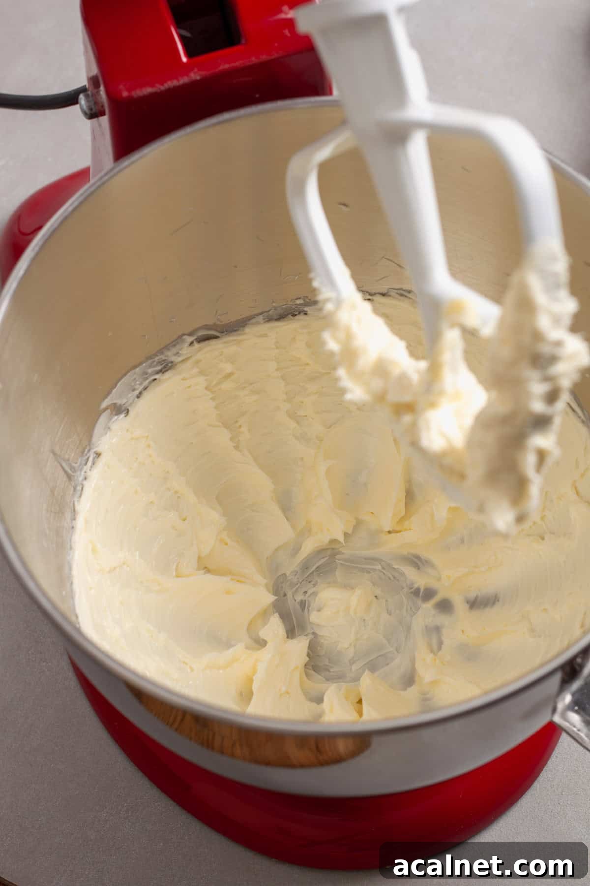 Softened butter getting whipped for homemade oatmeal cookies.
