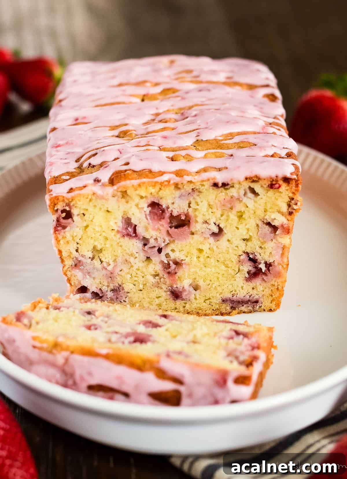 loaf of fresh strawberry bread with strawberry glaze