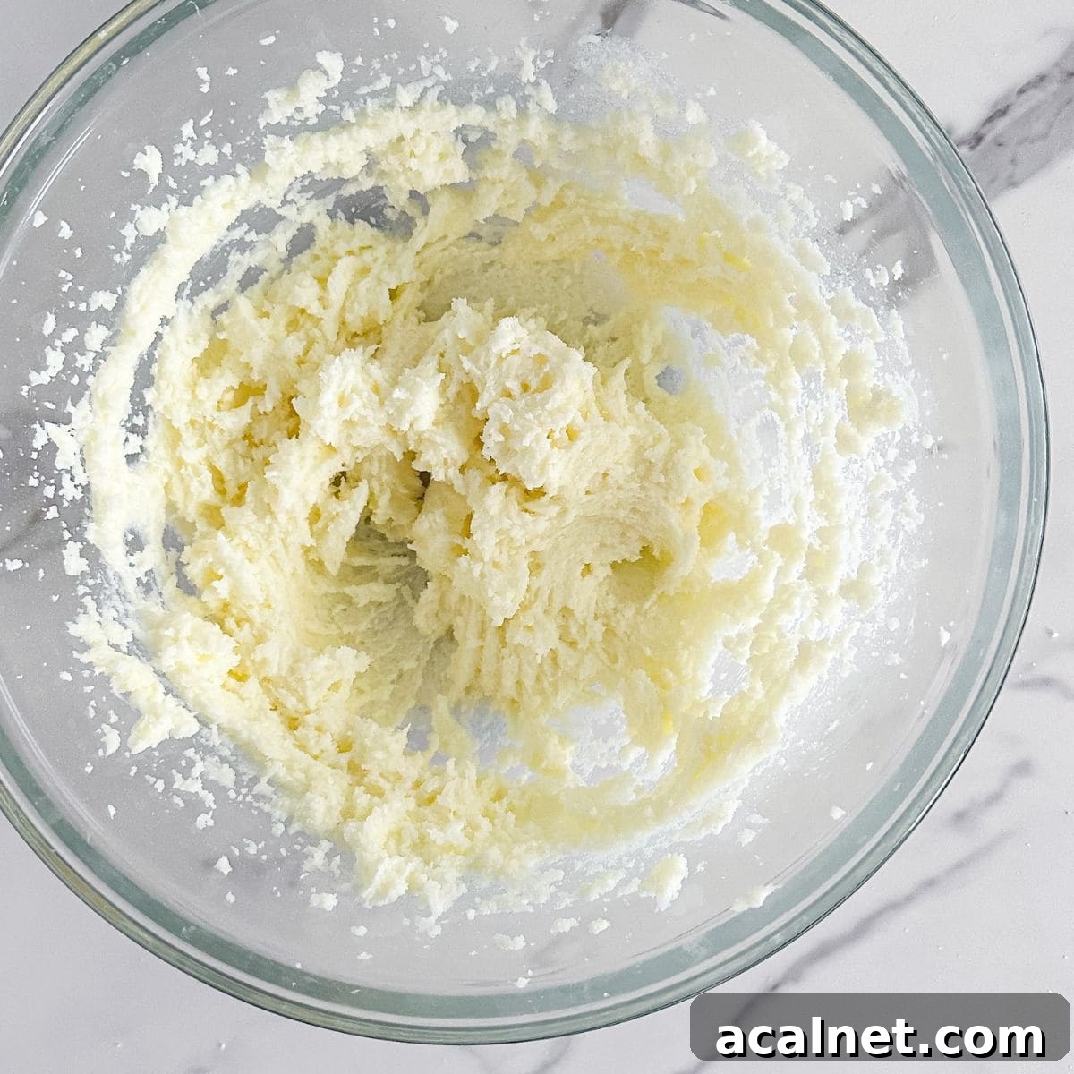 Creaming butter in a bowl.