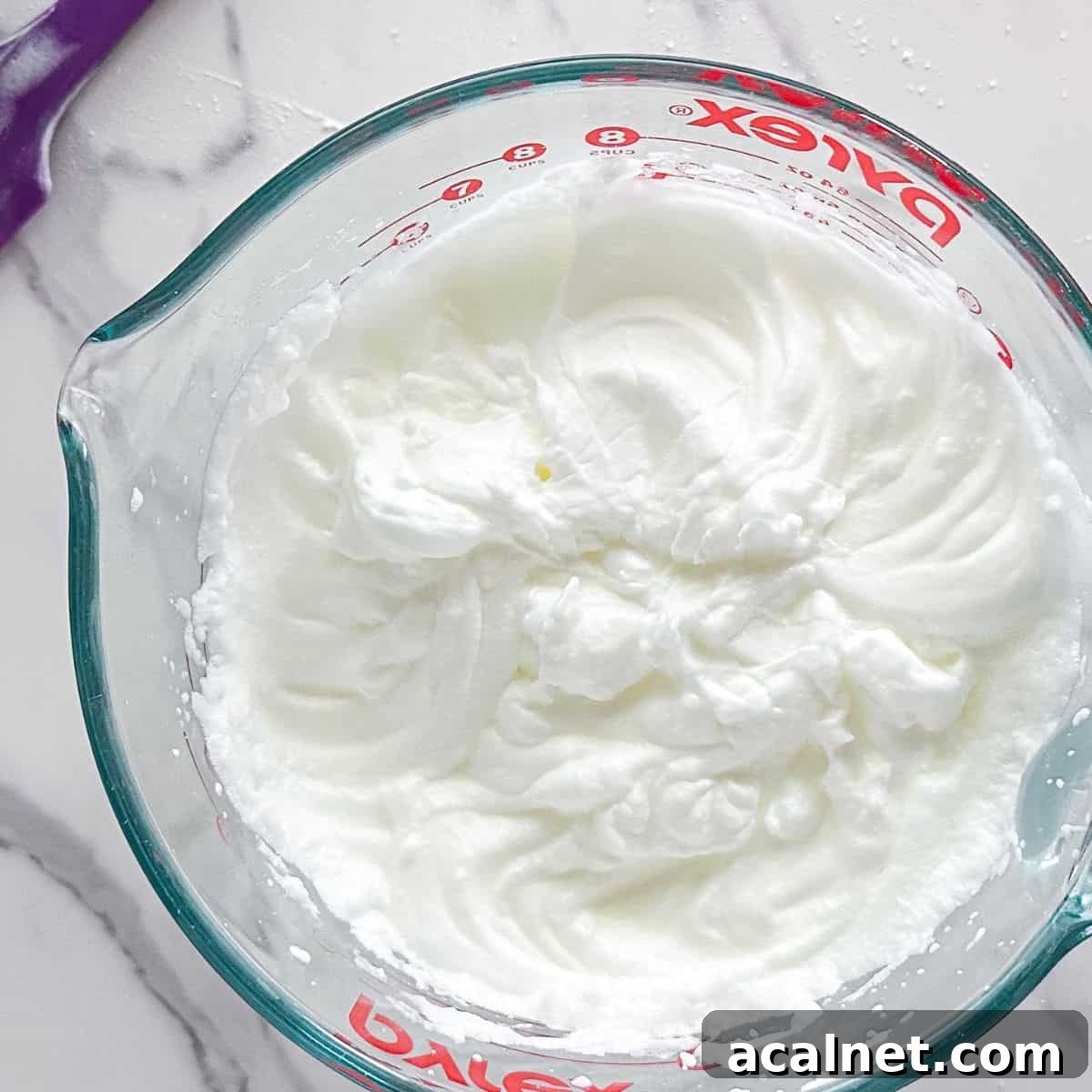 Whipping the frosting.