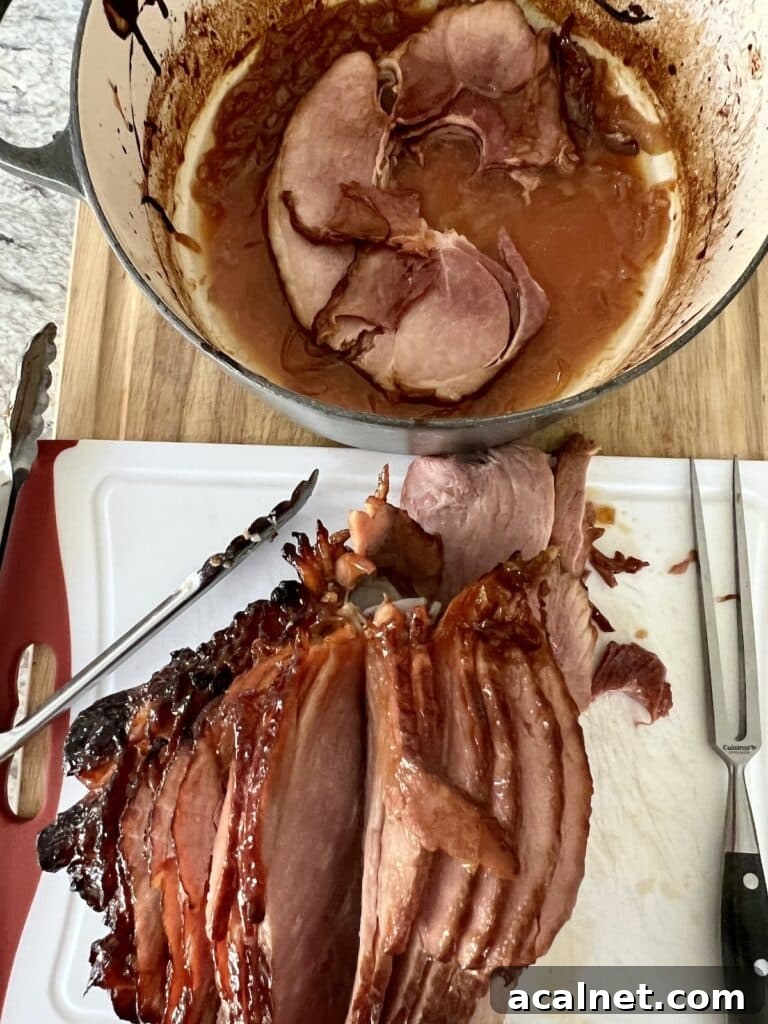 Slicing ham on cutting board next to Dutch oven.