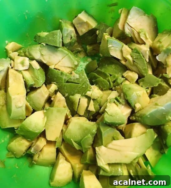 2 Avocados cut up in a bowl