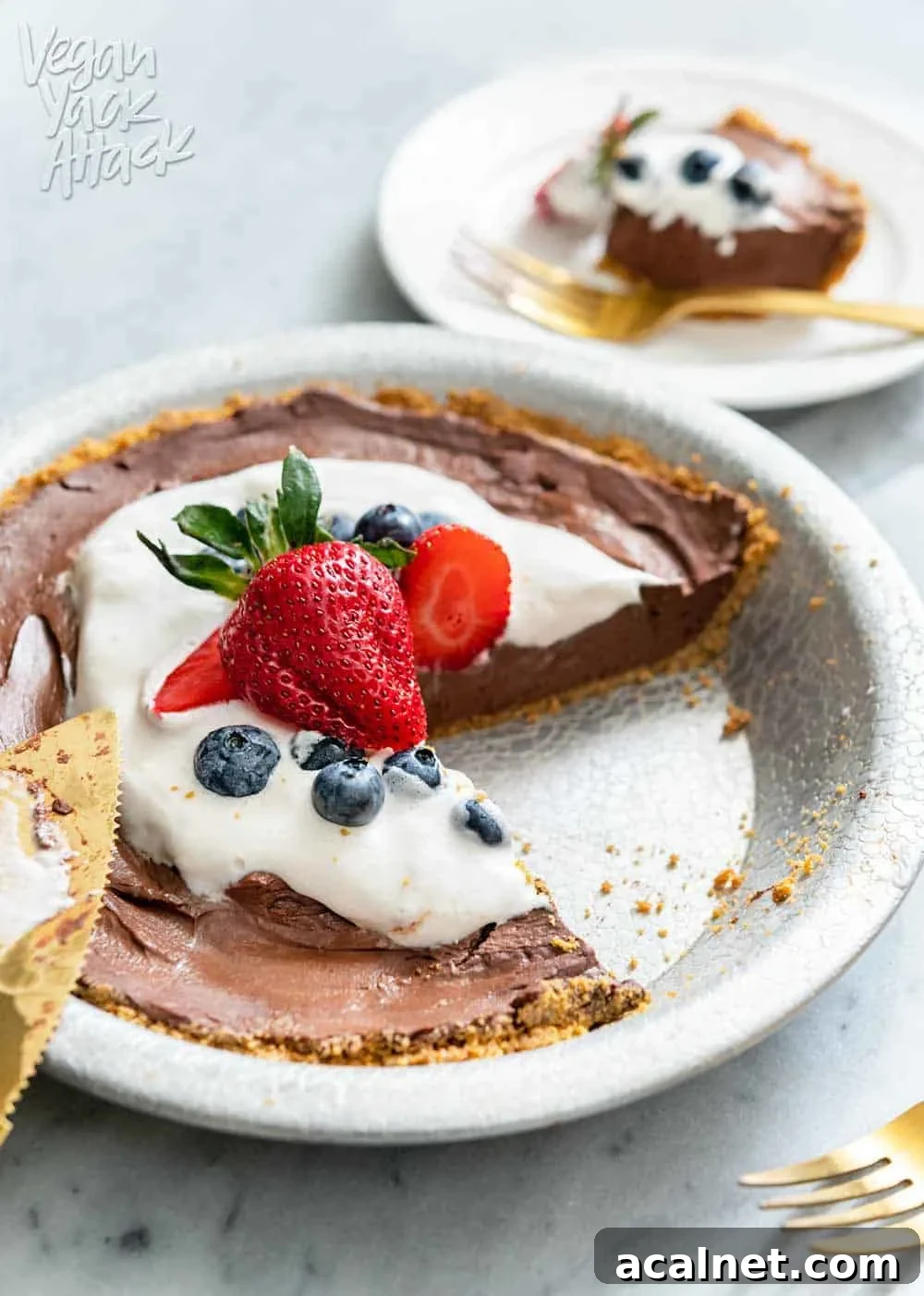 4-Ingredient Vegan Chocolate Pie for Budget Baking 7 Slice of chocolate pie on a plate next to whole pie and gold pie server