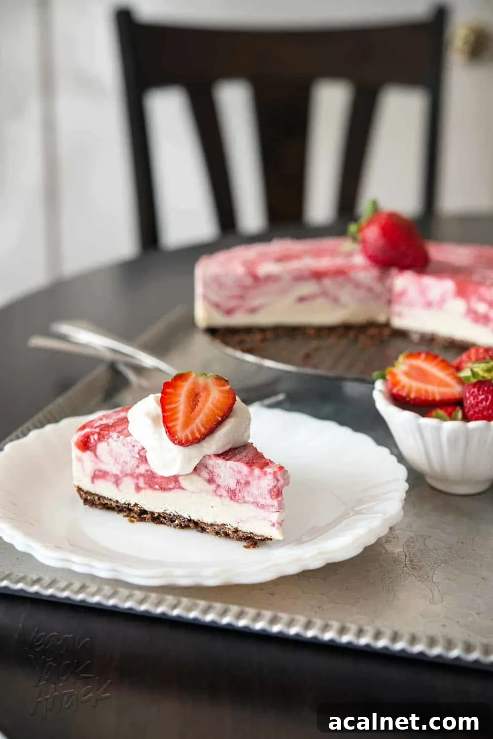 4-Ingredient Vegan Chocolate Pie for Budget Baking 14 Slice of strawberry swirl cheesecake on a white plate