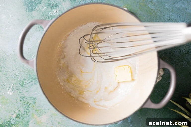 Butter added to a creamy coconut sauce.