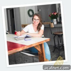 Author sitting at table smiling