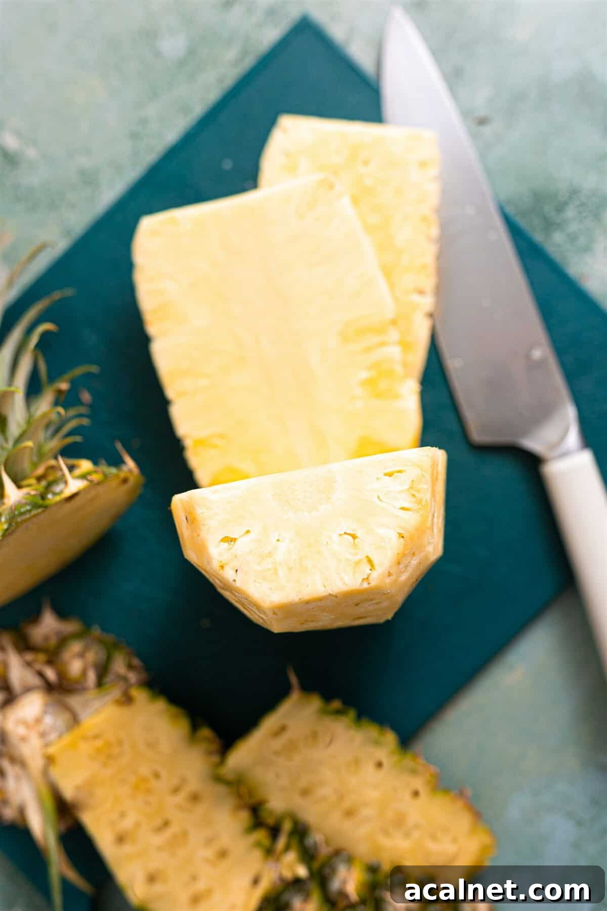 Pineapple being sliced to remove the core.