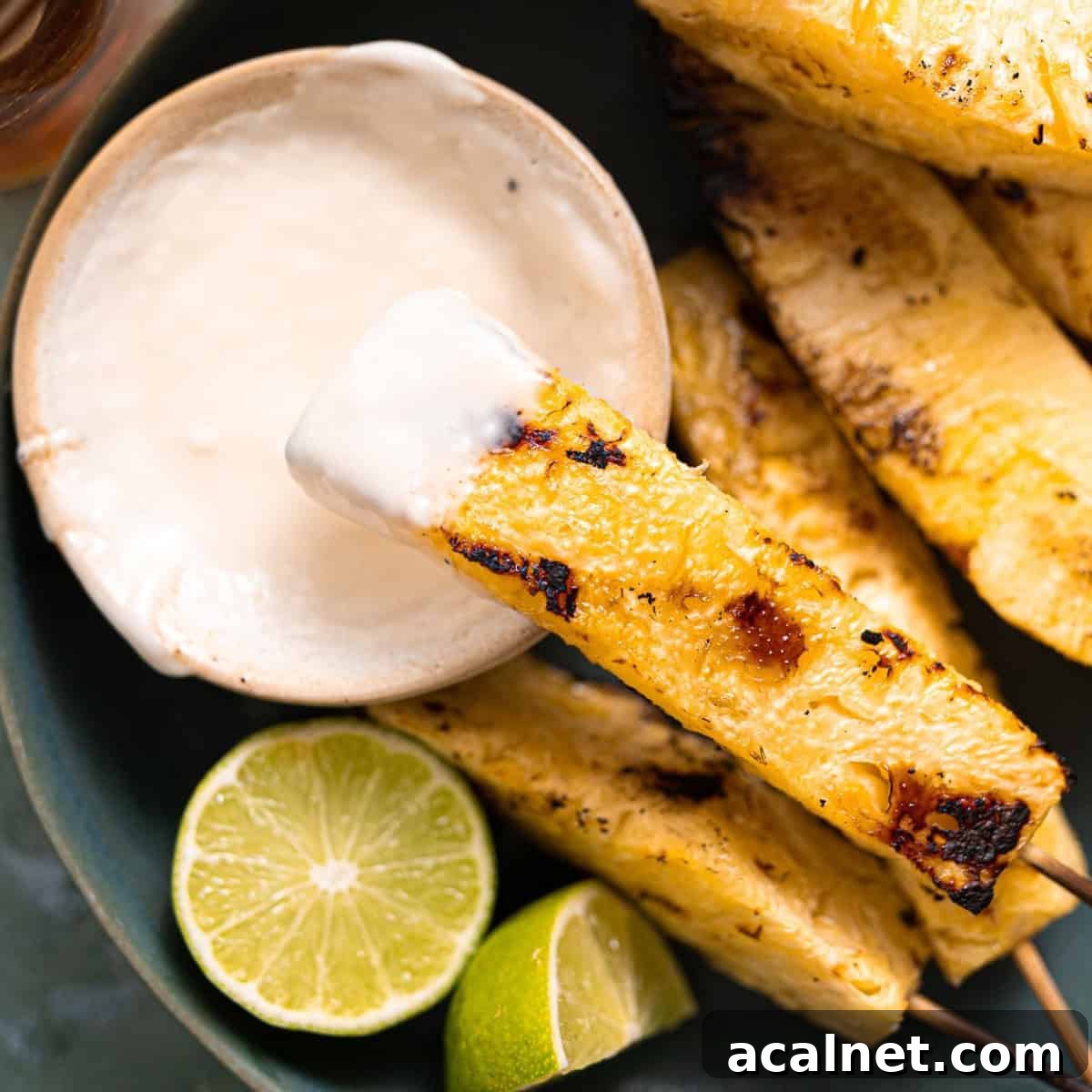 Grilled pineapple with coconut cream sauce.