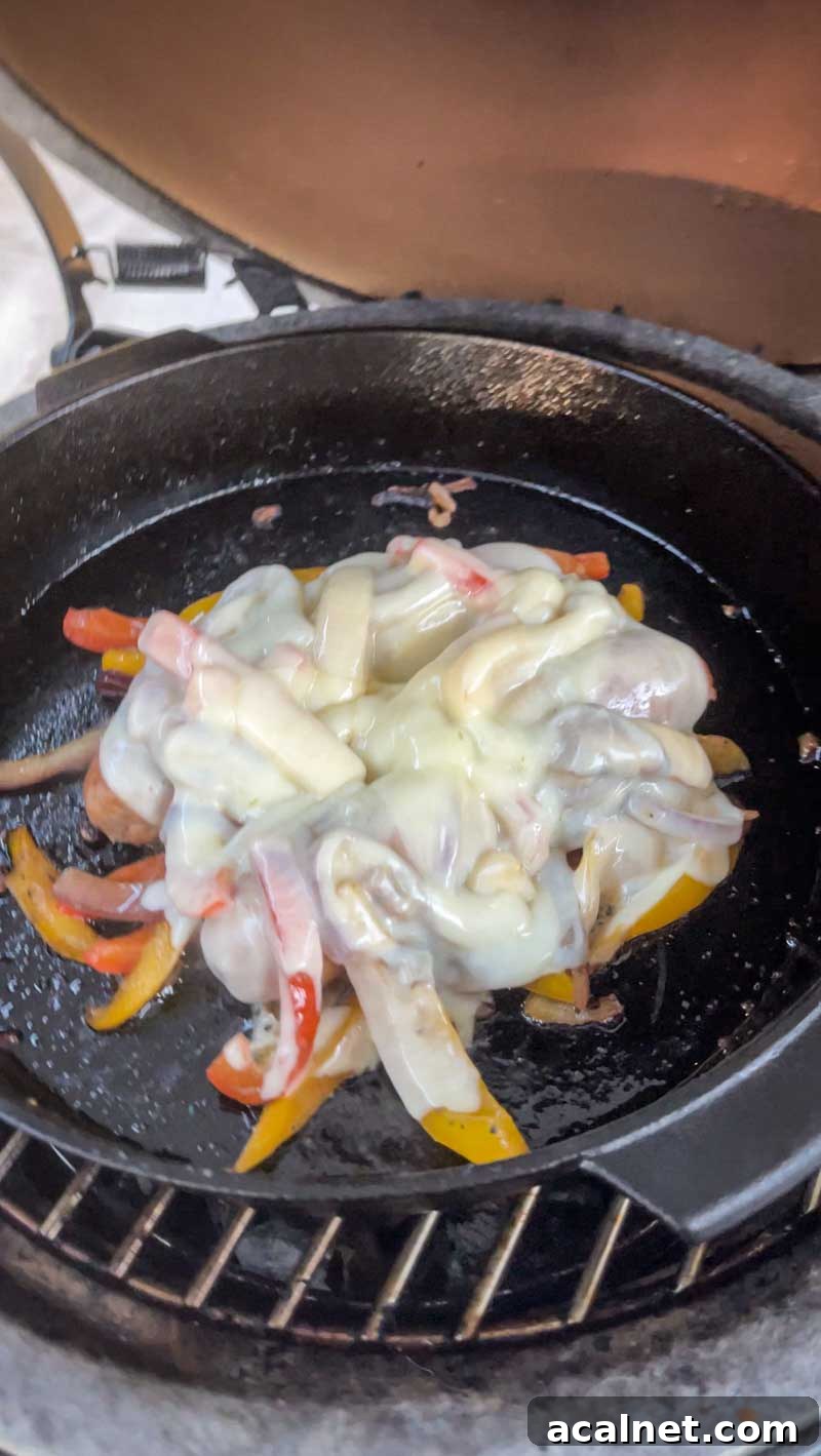 Cheese bubbling on sausages