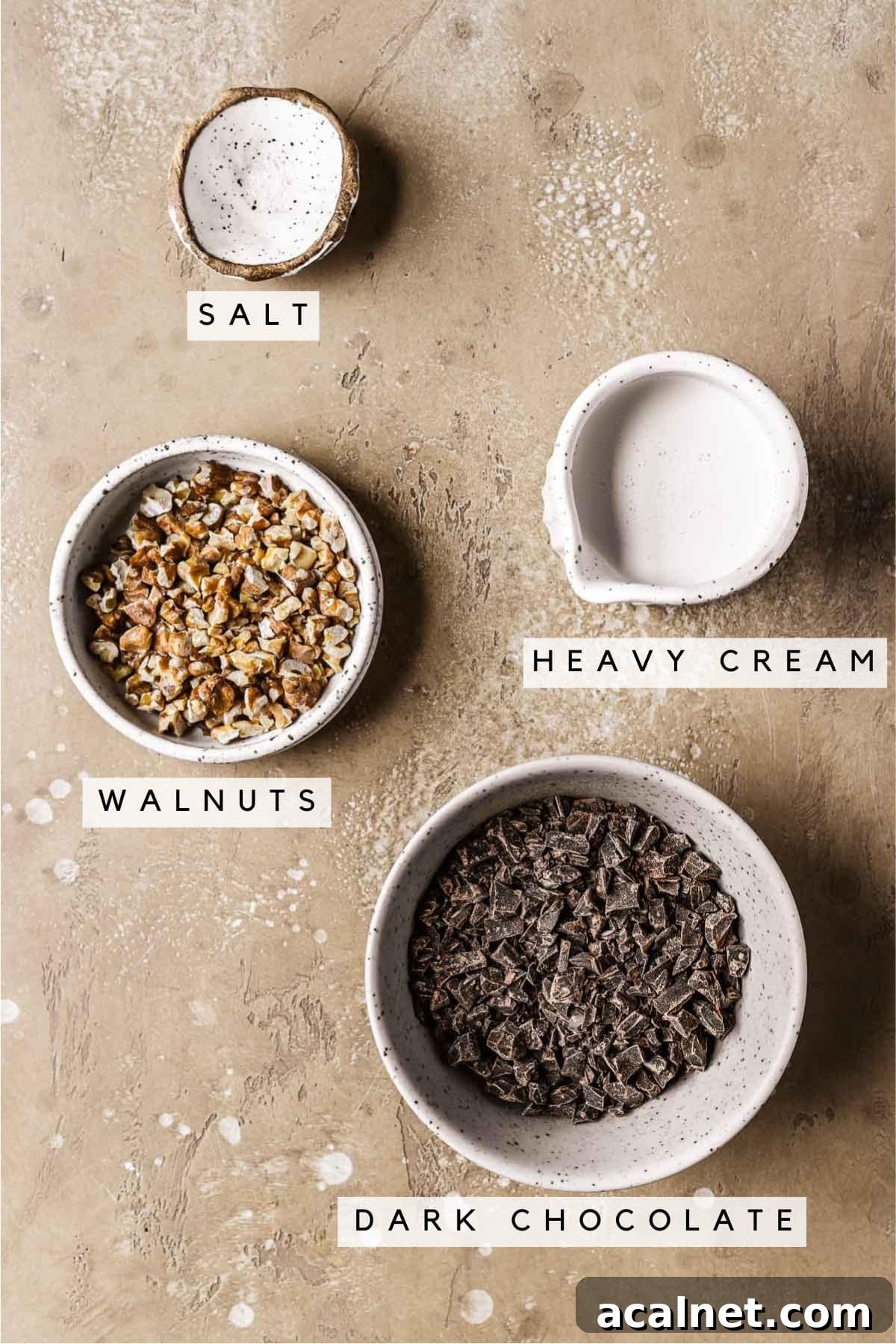 Labeled ingredients in bowls for whipped chocolate ganache.